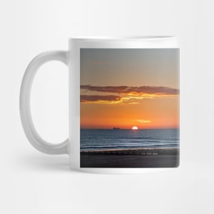 Sunrise over a tranquil North Sea Mug